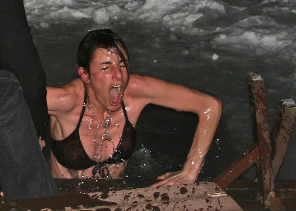 Woman gasping in cold water